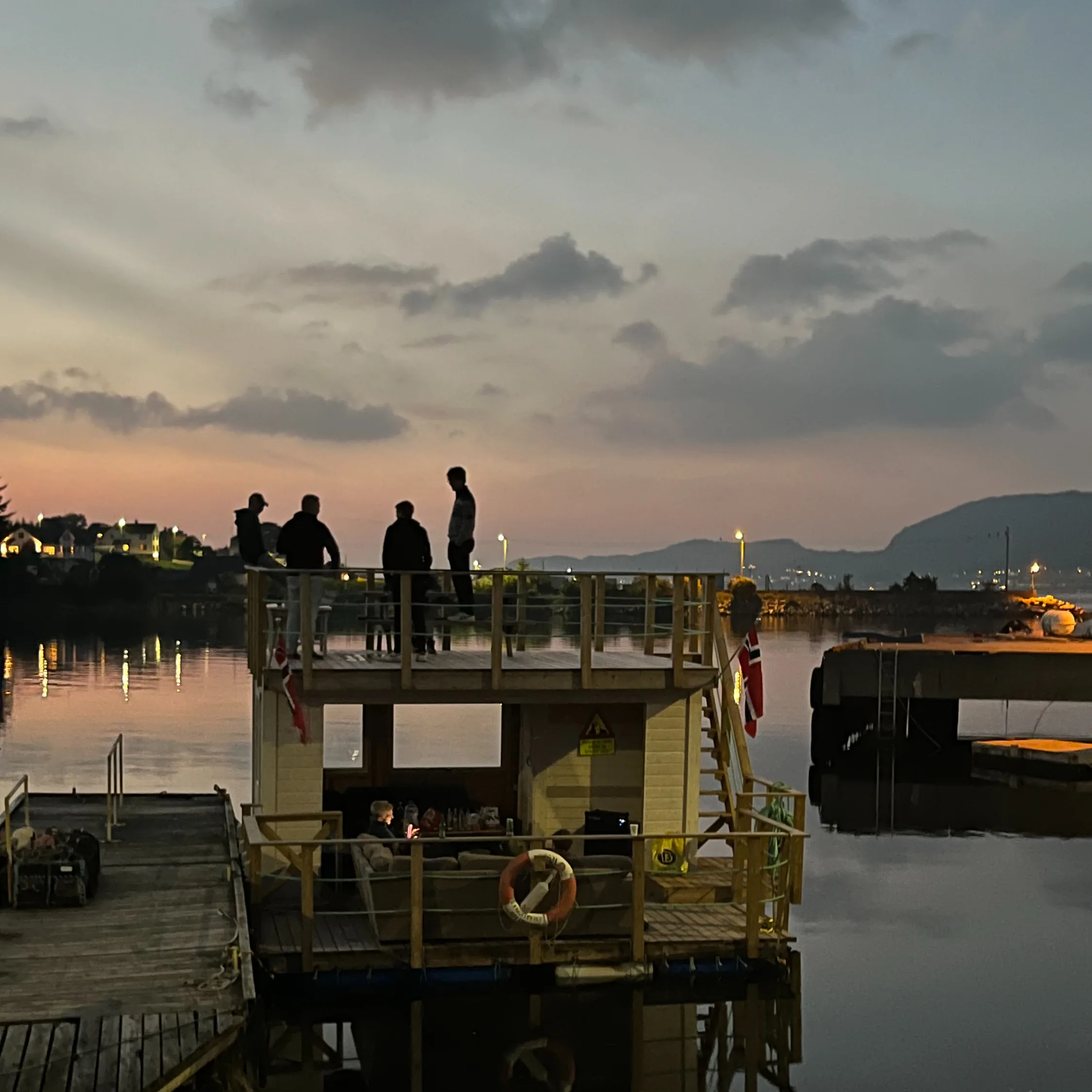 Audun Aakre and friends on their raft at Haram­søya on a summer evening