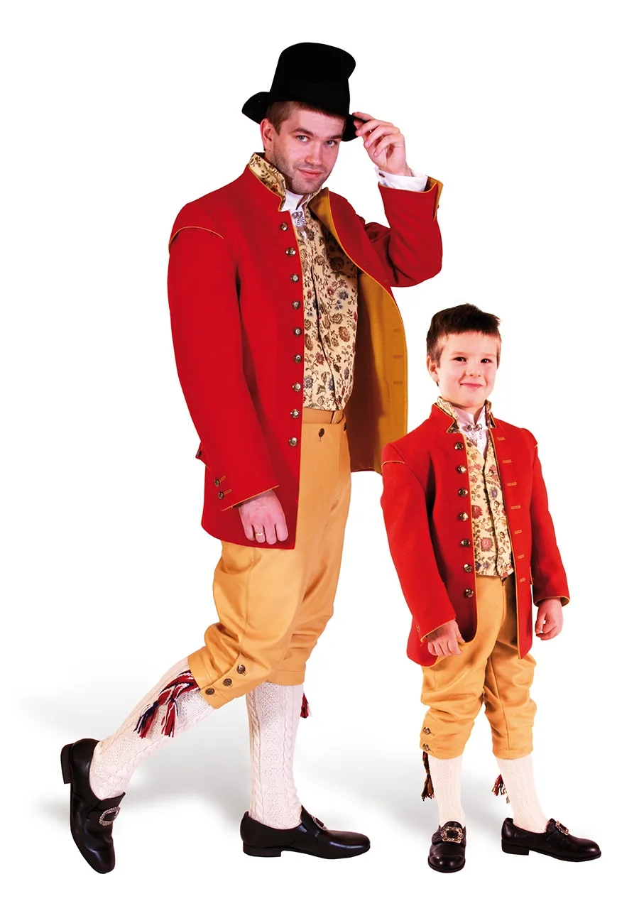 A man and a boy wearing Embedsmannsdrakt from Romsdal