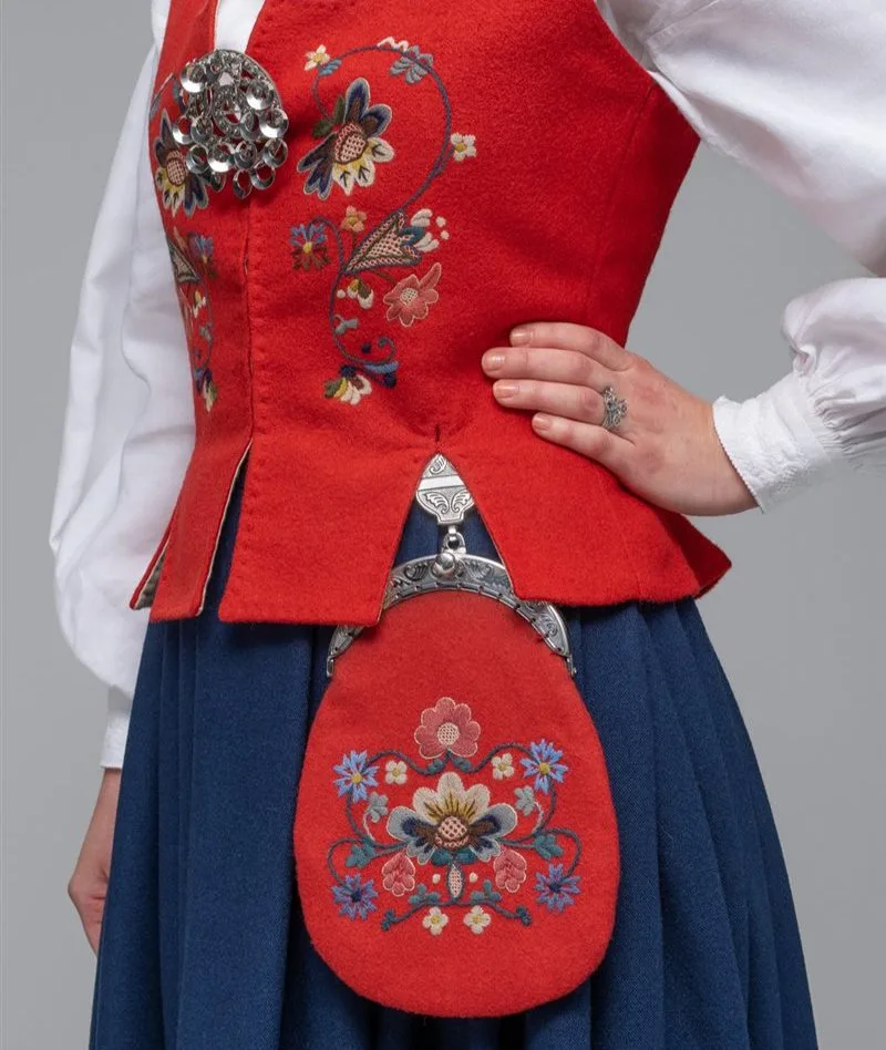 A woman in a Bolsøy bunad in red