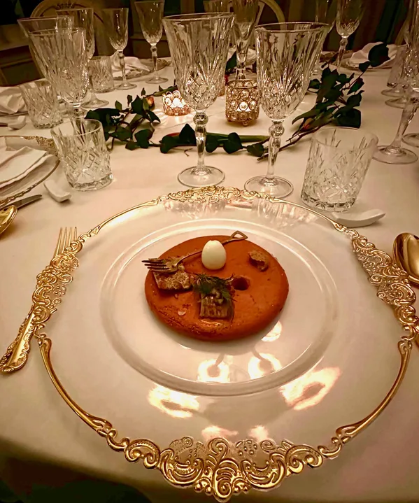 A refined dish beautifully presented on heirloom porcelain