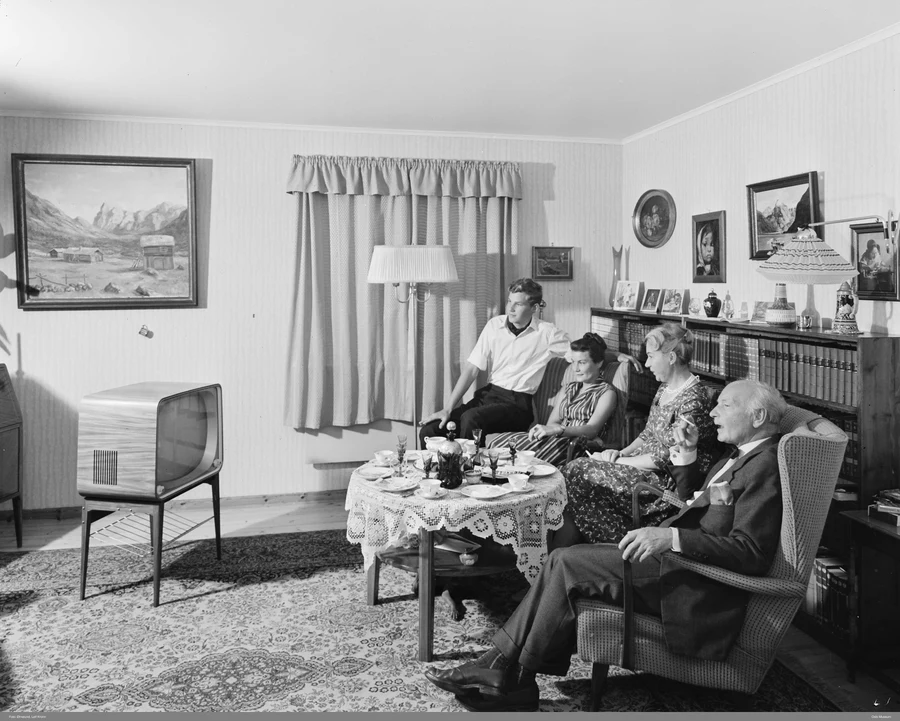 Two women watching one of the first television sets in Norway, 1947, black and white photograph from Oslo Museum