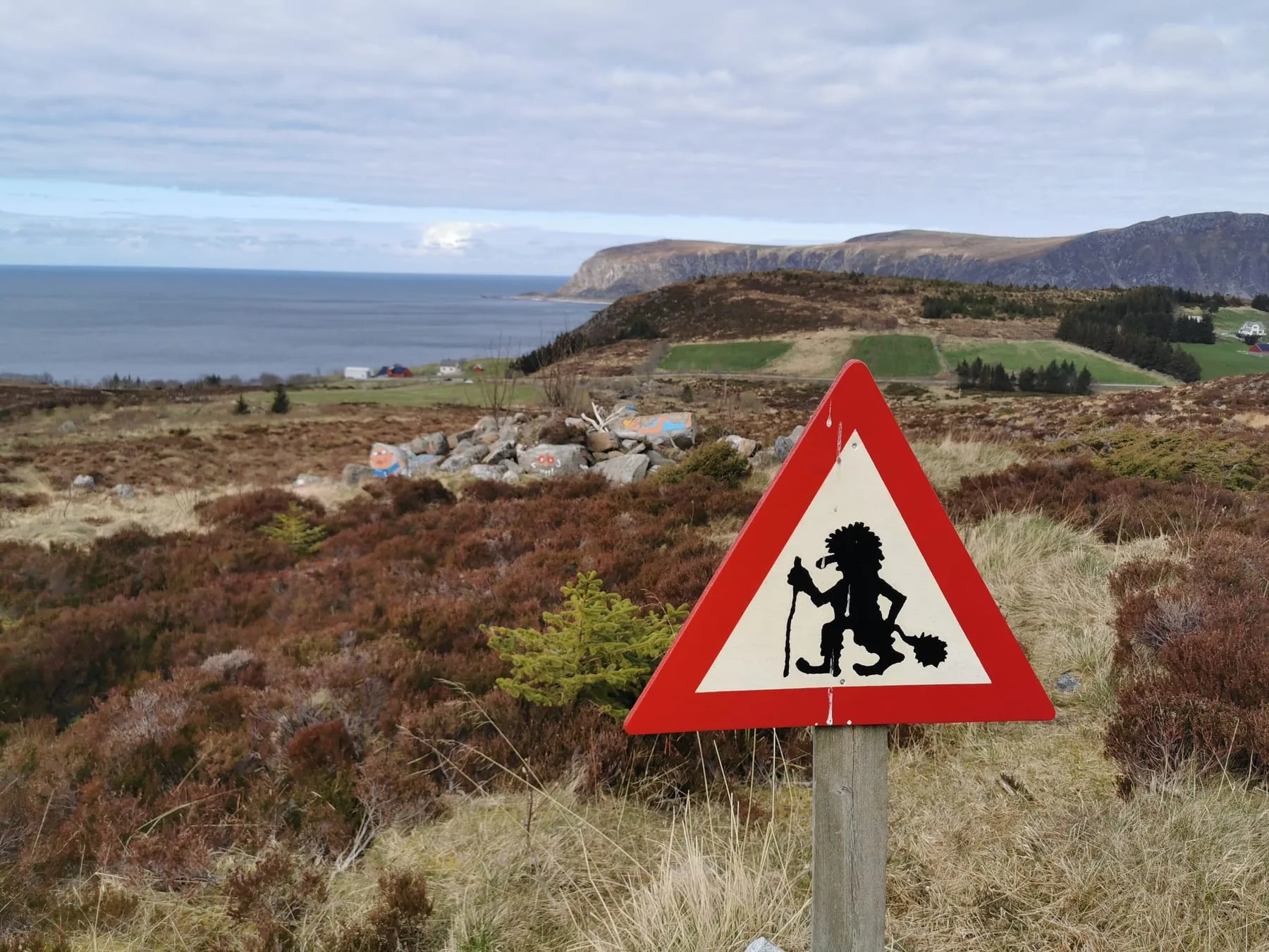 Mountain landscape at Goaldet on Lepsøya with troll figure silhouette overlooking the ocean and surrounding islands