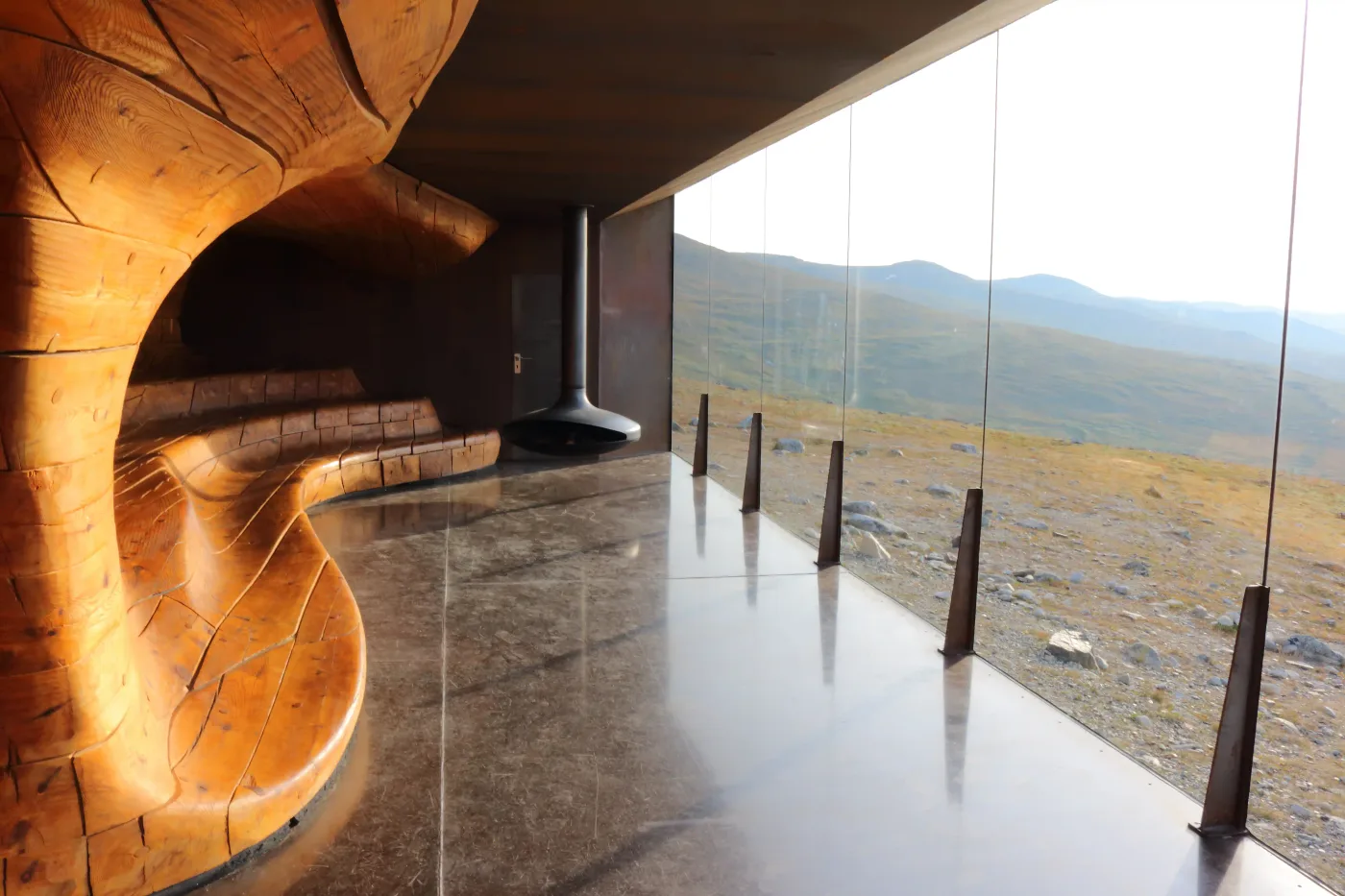 The angular modern architecture of Viewpoint Snøhetta observation pavilion set against the Dovrefjell mountain landscape