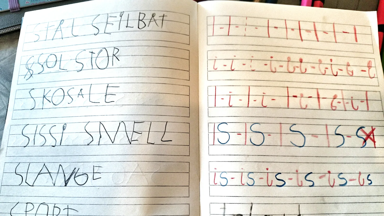 A notebook with Norwegian exercises for first graders, with colorful handwriting