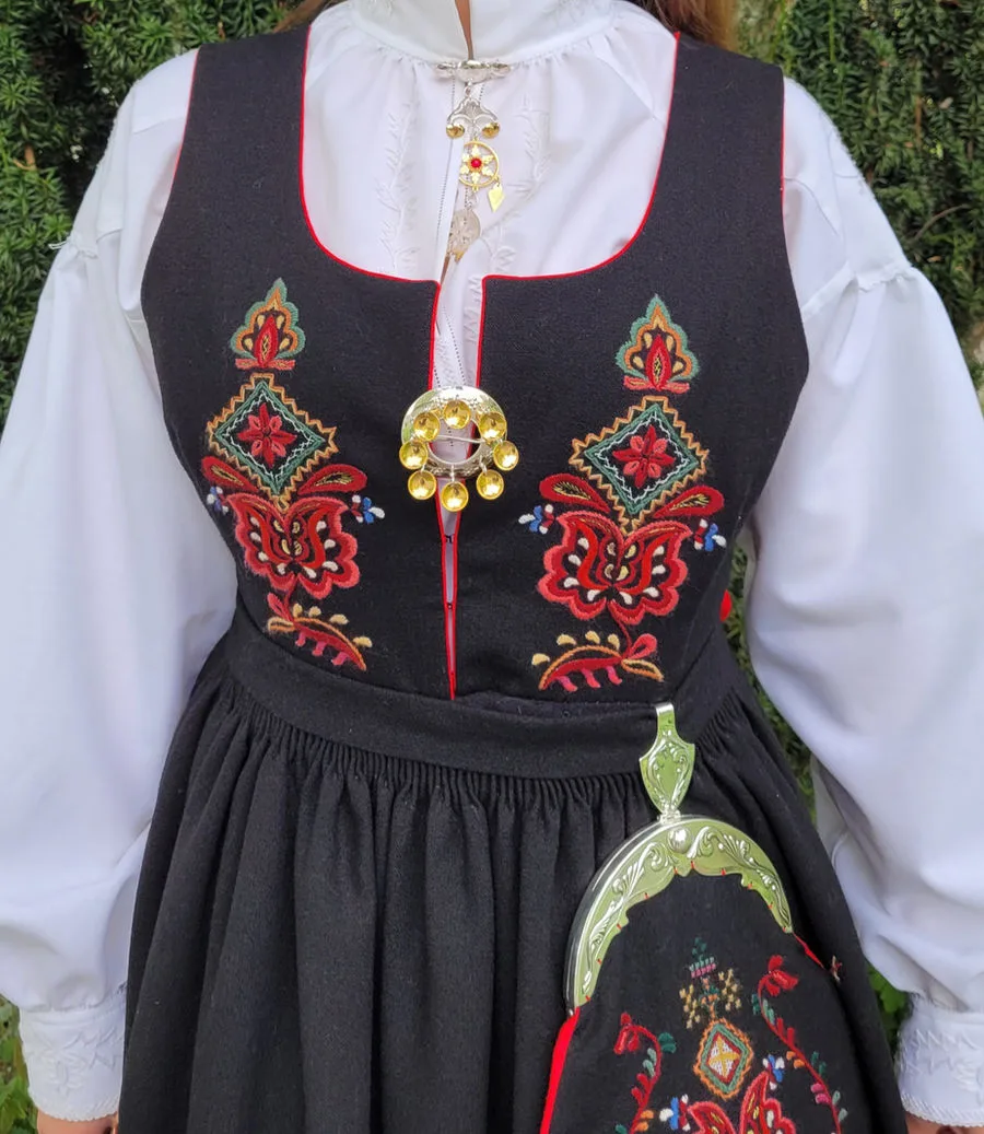 Close-up of intricate embroidery details on the Ørskog bunad bodice and skirt