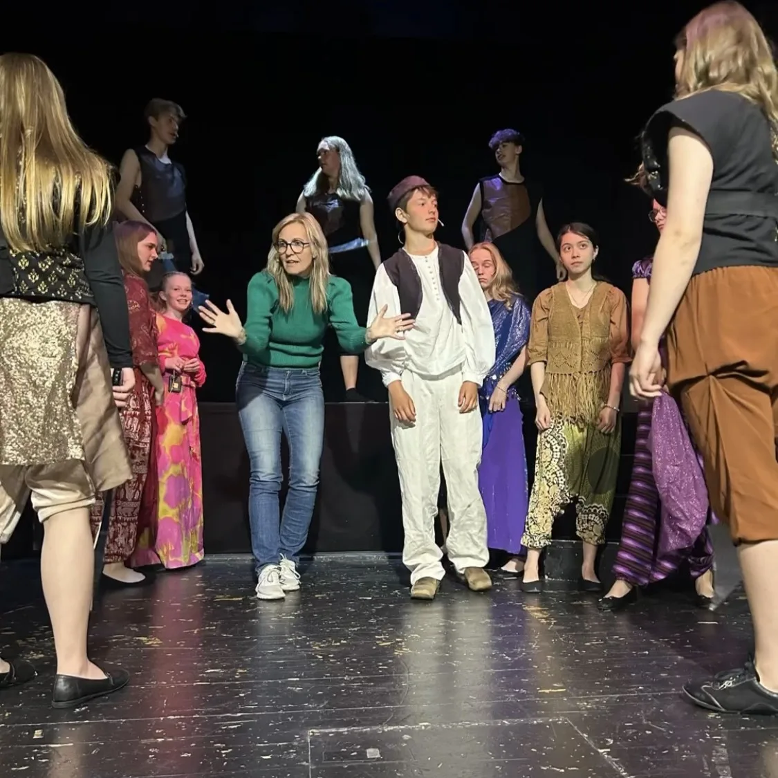 Linda Nogva Vedeld working meticulously on a theater production backstage