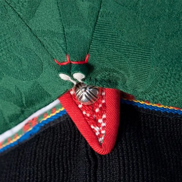 Close-up of the klauv at the back of a Vest-Agder bunad bodice, showing intricate small pleats in dark fabric