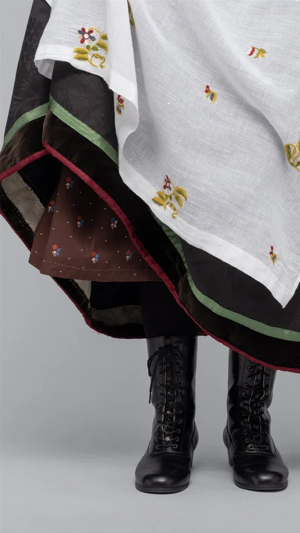 A striped cotton underskirt for the Vest-Agder bunad, gathered at the waist, with colourful horizontal stripes