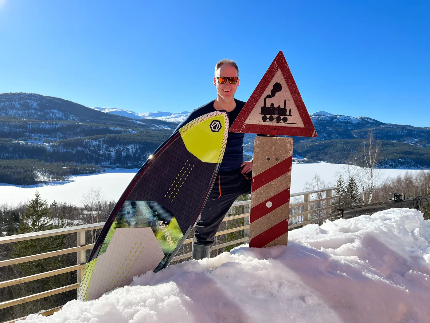 The old Ørgenvika train station by lake Krøderen, now a private retreat surrounded by lush greenery