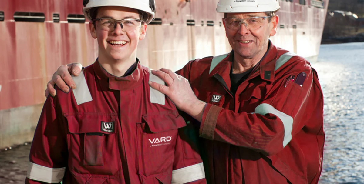 Colleagues at the shipyard — working safely and supporting each other on site.
