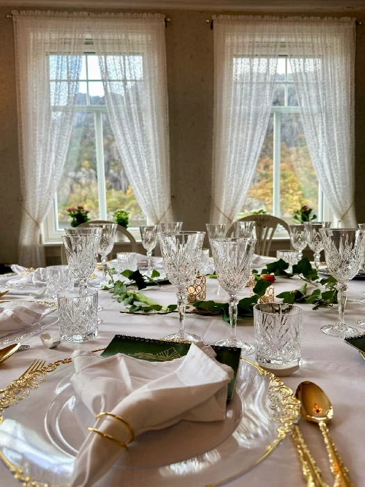 Fine dining table setting at Oldemors Hus with vintage cutlery and glasses