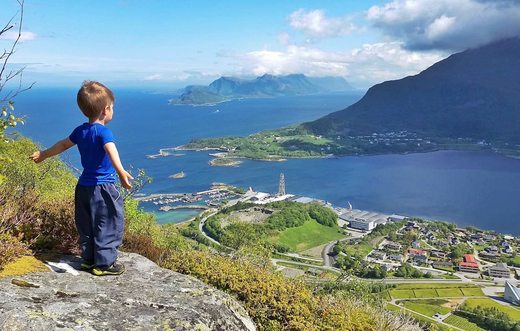 Brattvåg village at sunset with fjord and mountains