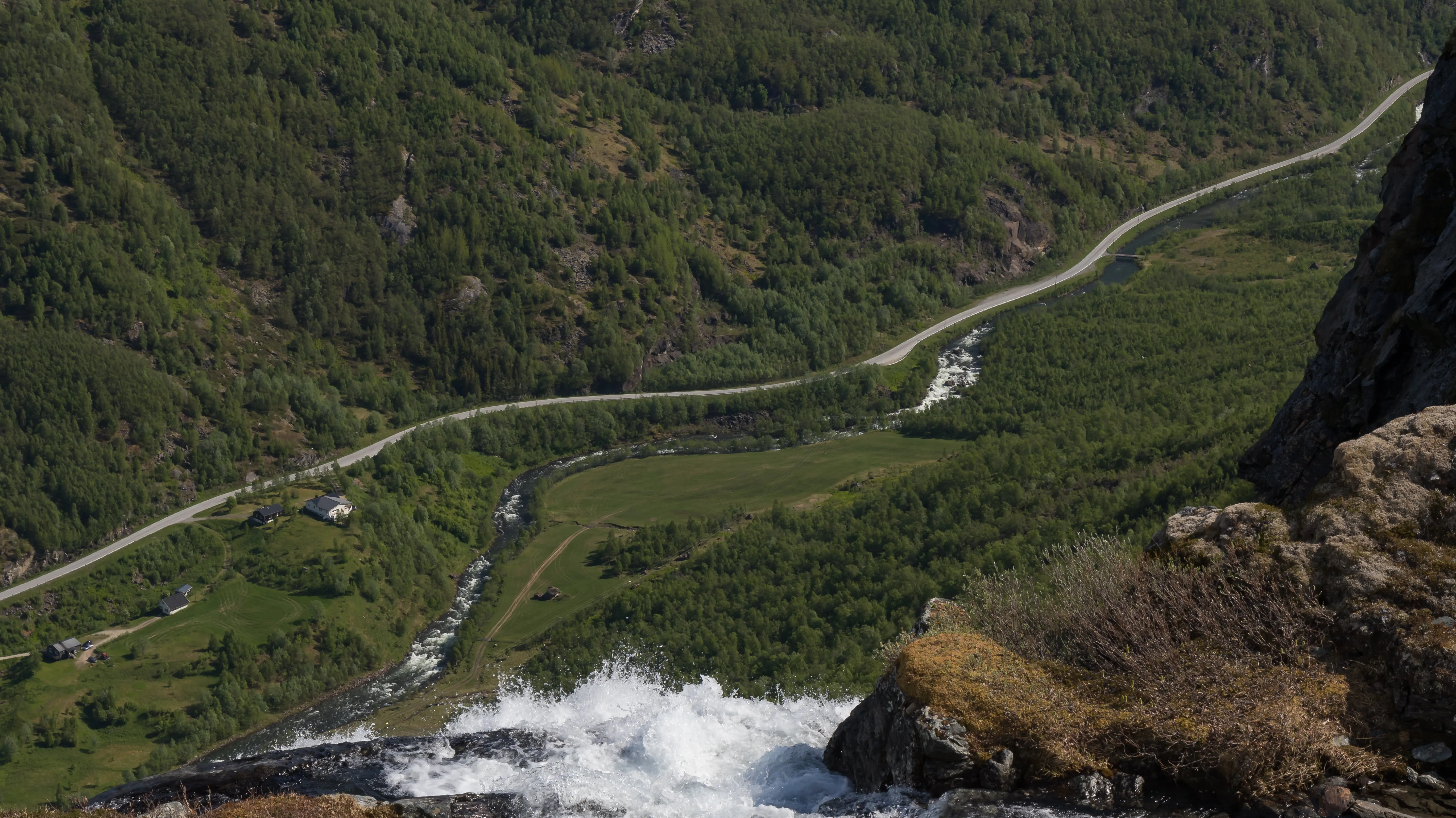 View from Fossbakken down the valley with mountains on each side