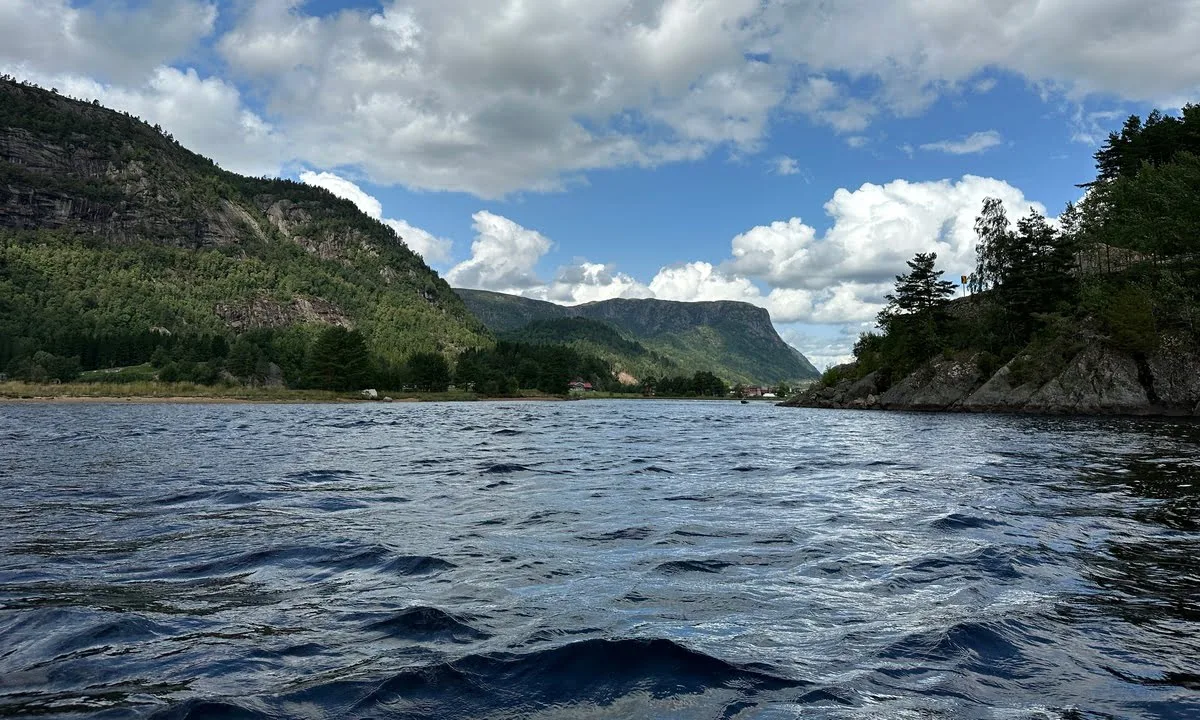 Lake with mountains in the background