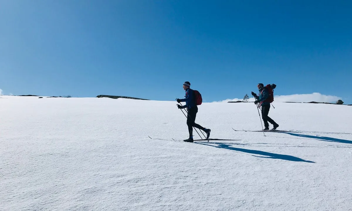 Two people skiing