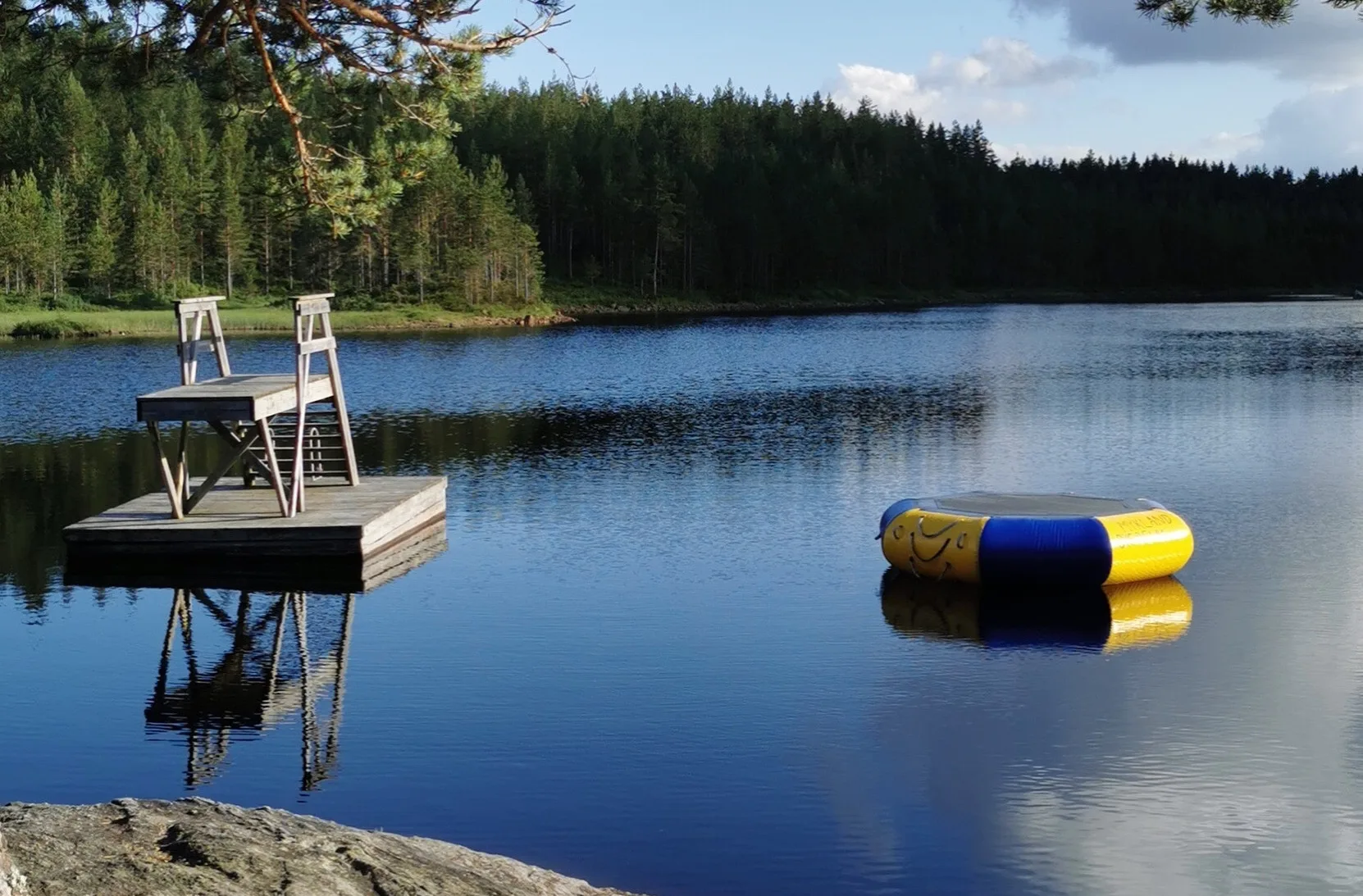Lake Langevann with pier and beach in Mykland