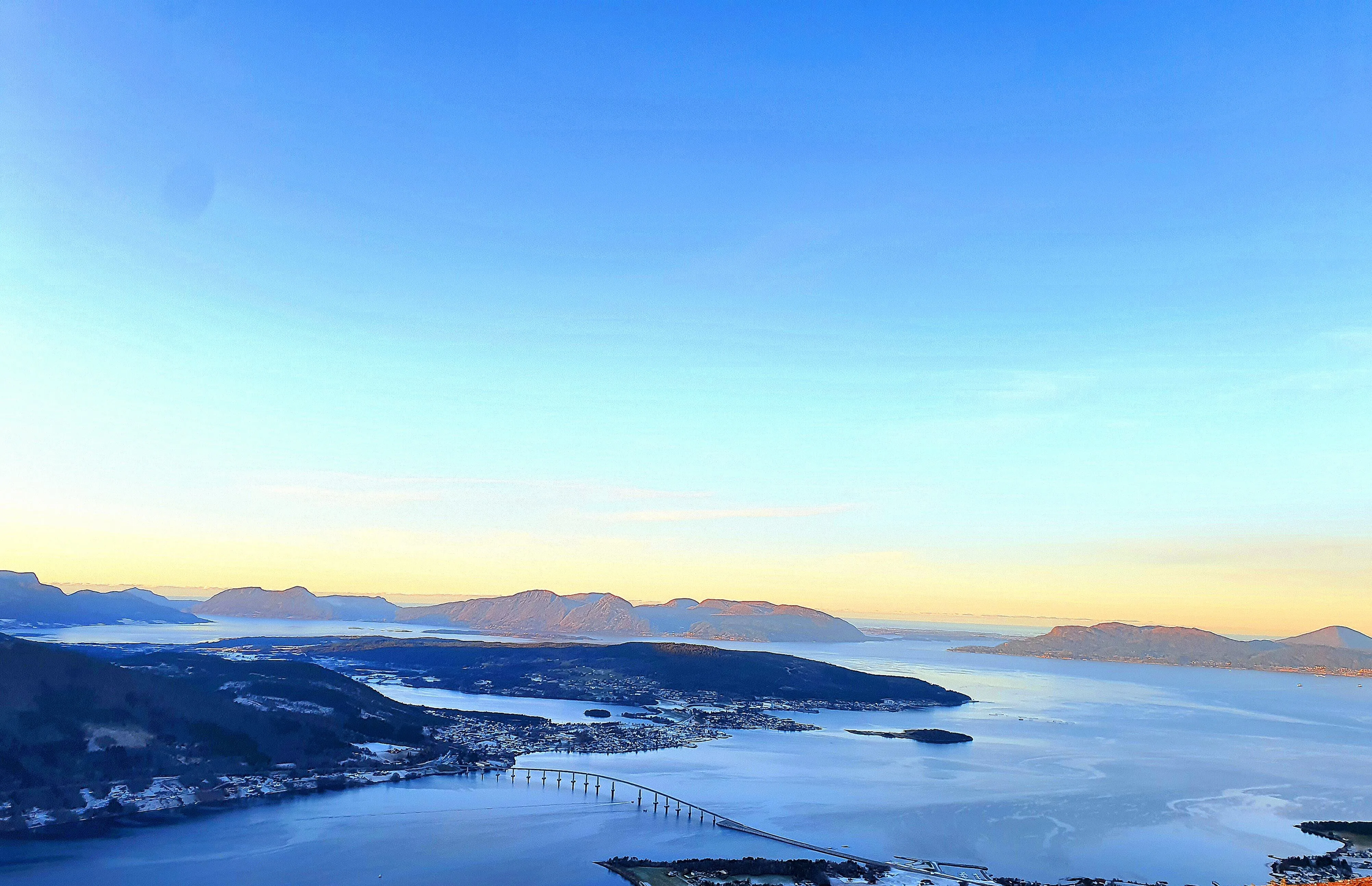 Fjord landscape near Vikebukt under a wide blue sky